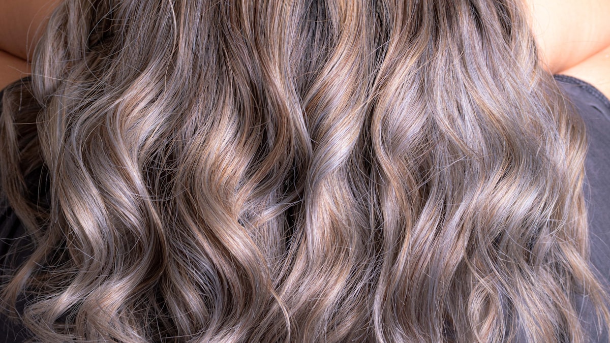 Warm balayage tones in natural light